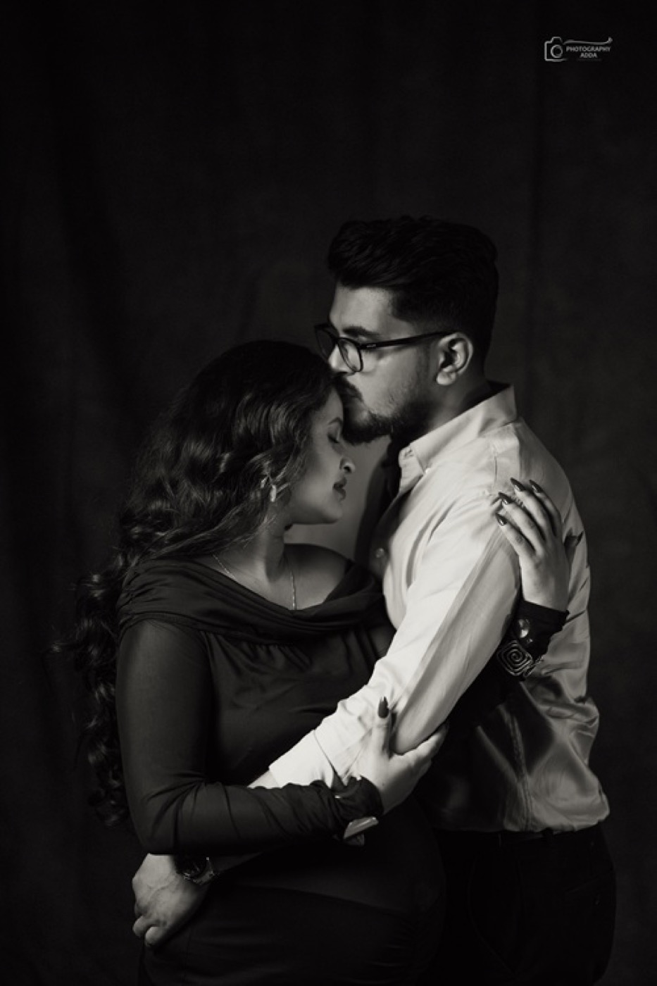 Elegant black and white maternity couple portrait