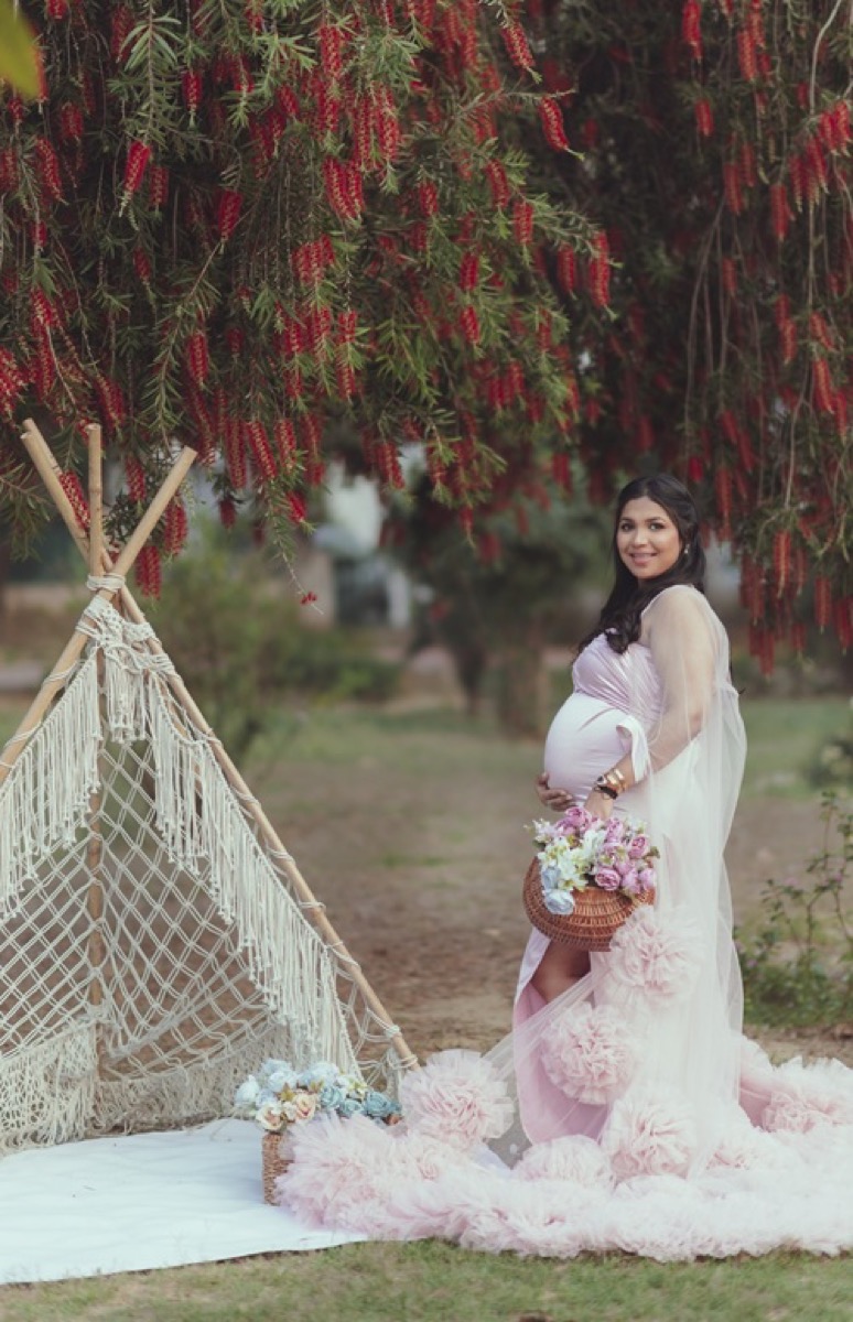 Outdoor maternity teepee floral gown photoshoot